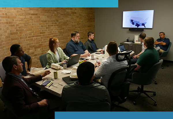 contigo technology employees having a meeting